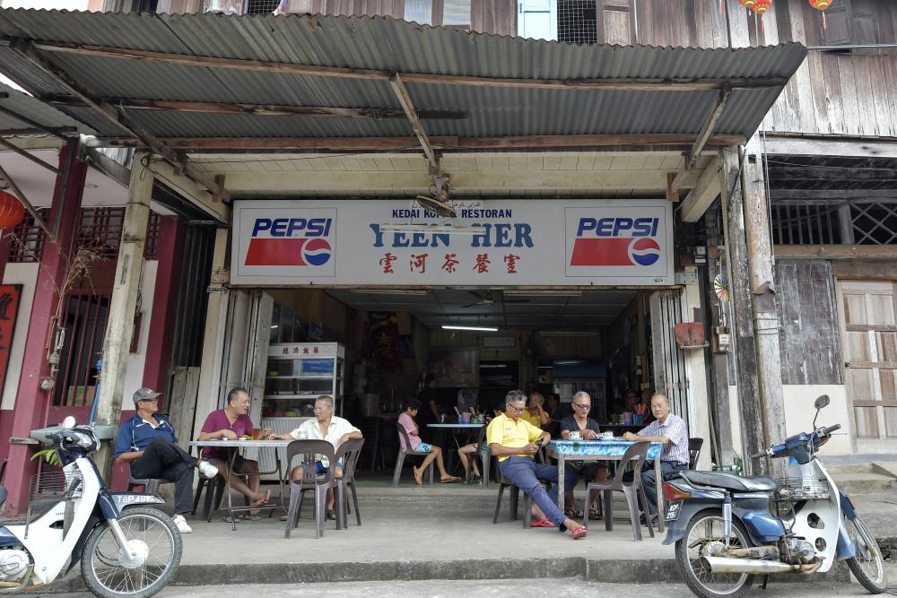 Several residents enjoyed a drink at Kampung Baru Ayer Jerneh, Kemasik, on Jan 27, 2018. — Bernama