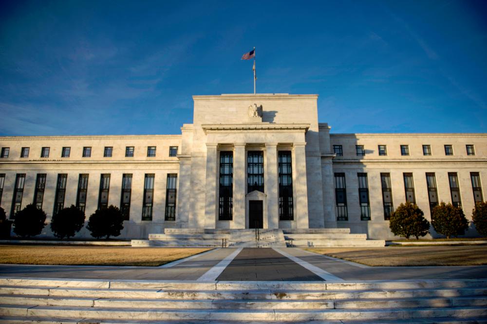 A view of the Federal Reserve in Washington, DC. The Fed has left the outlook for interest rates to be unchanged for the rest of the year. - AFPPIX