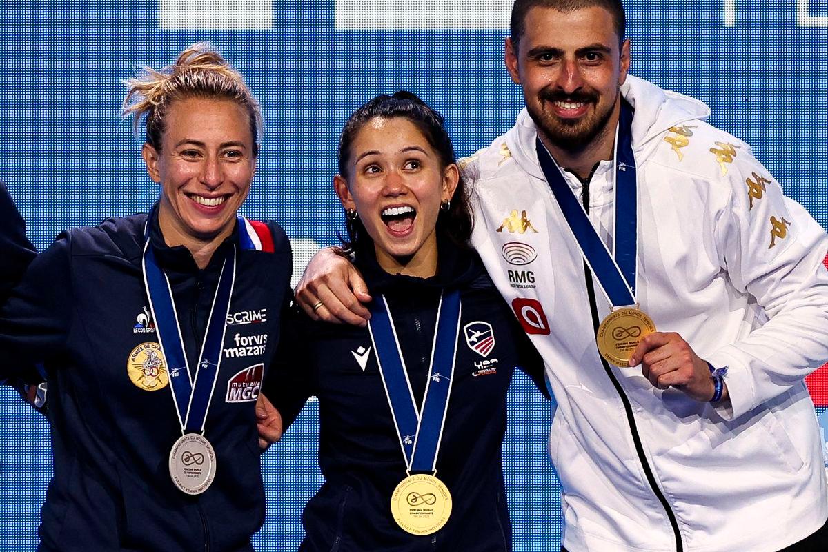 Silver medallist France’s Pauline Ranvier, gold medallist US Lee Kiefer and gold medallist Georgia’s Sandro Bazadze celebrate after medal ceremonies for the women’s foil individual competition and the men’s sabre individual competition at the FIE Fencing World Championships in Tbilisi on July 25, 2025. Photo by Giorgi ARJEVANIDZE / AFP