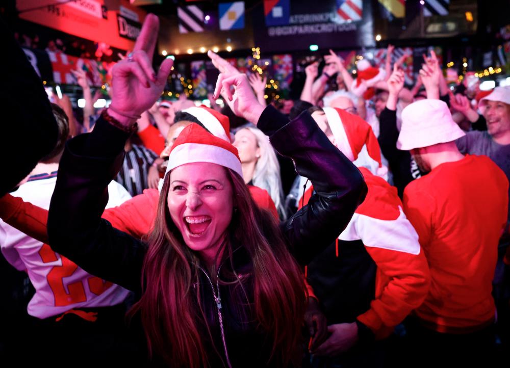 England fan wearing a Santa Claus hat reacts after the match/REUTERSPIX