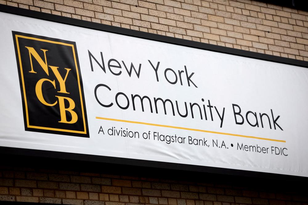 A sign is pictured above a branch of the New York Community Bank in Yonkers, New York. – Reuterspic