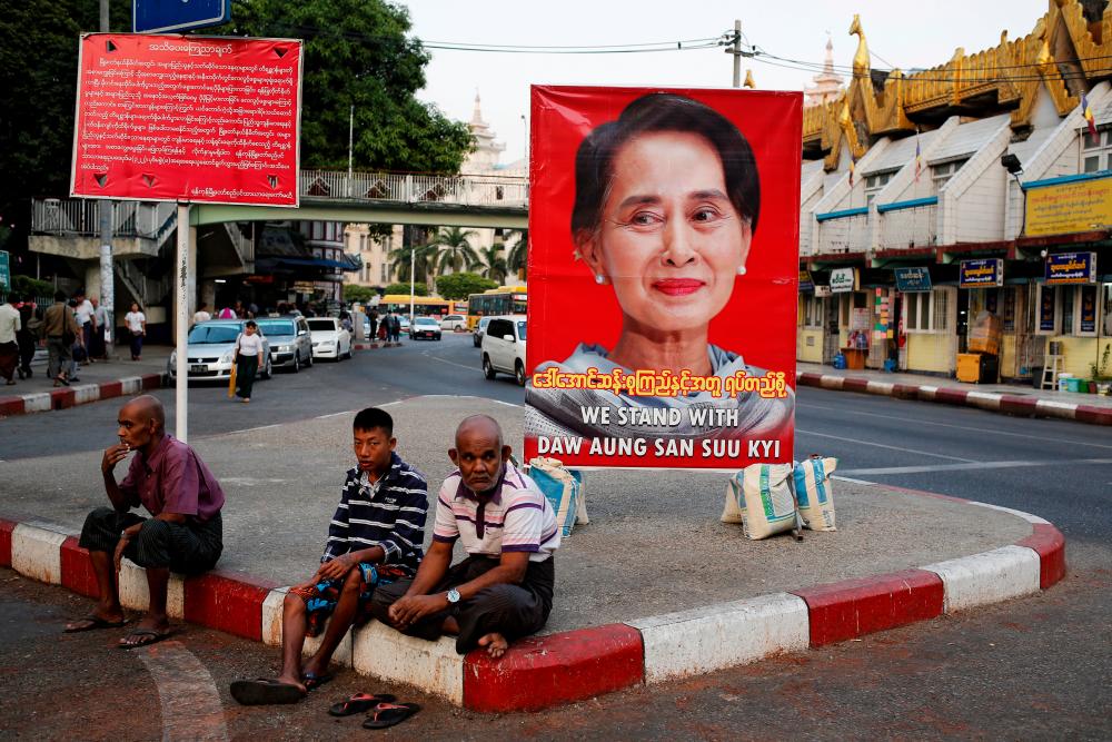A poster supporting Aung San Suu Kyi as she attends a hearing at the International Court of Justice is seen in a road in Yangon, Myanmar, December 12, 2019. - Reuters
