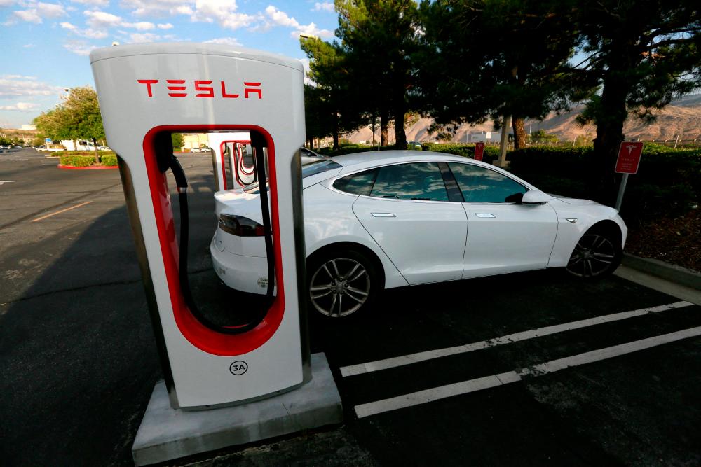 A Tesla Model S charging at a Tesla Supercharger station in Cabazon, California. – Reuterspic