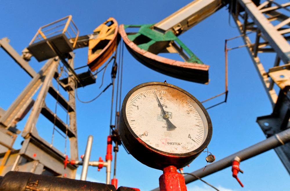 A view of a pressure gauge near oil pump jacks. Crude oil has fallen about 16% since late September. – Reuterspic