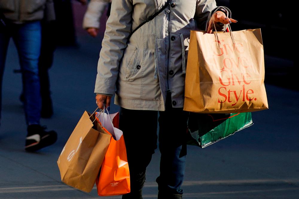 The crucial holiday shopping season has shifted into high gear, with survey data from the US National Retail Federation suggesting consumers plan to spend about 5% more this year. – Reuterspic