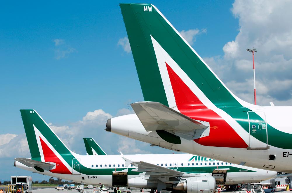 Alitalia planes are seen on the tarmac at Fiumicino International Airport, in Rome. ITA will get 85% of the old Alitalia slots at Milan's Linate airport and 43% at Rome's Fiumicino hub. – REUTERSPIX