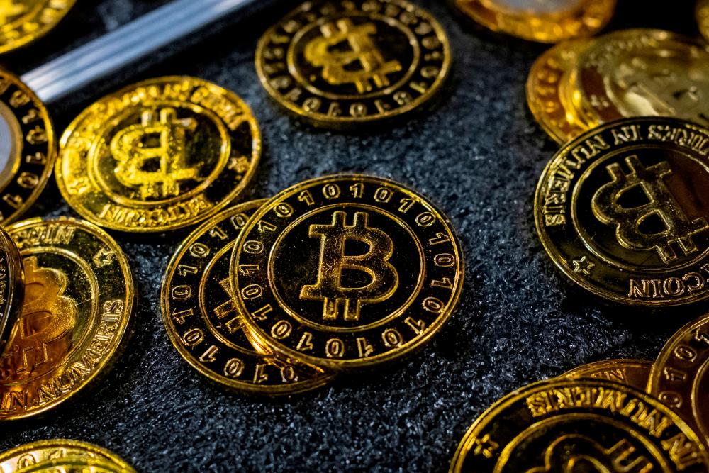 Bitcoin coins are seen at a stand during the Bitcoin Conference 2023, in Miami Beach, Florida,in May 2023. Investors are confident the US SEC could approve multiple spot bitcoin ETF as early as January. – Reuterspic