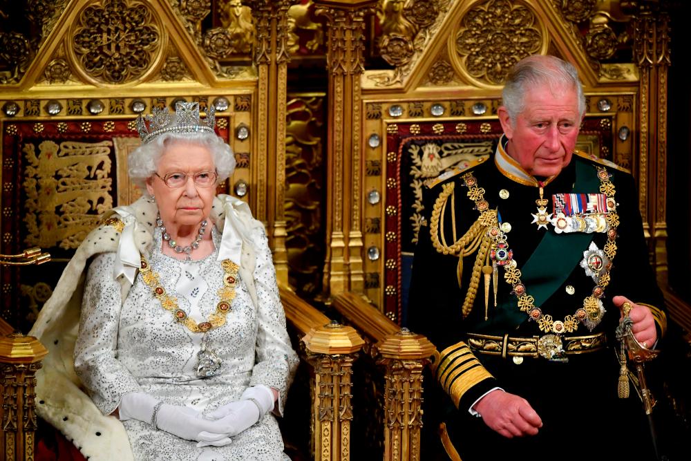 FILE PHOTO: Britain's Queen Elizabeth and Charles, the Prince of Wales are seen ahead the Queen's Speech during the State Opening of Parliament in London, Britain/REUTERSPix