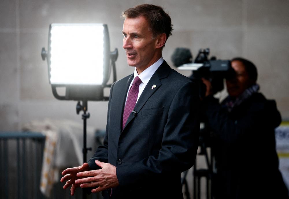 Hunt talking to a television crew outside the BBC headquarters in London on Nov 18. – Reuterspic