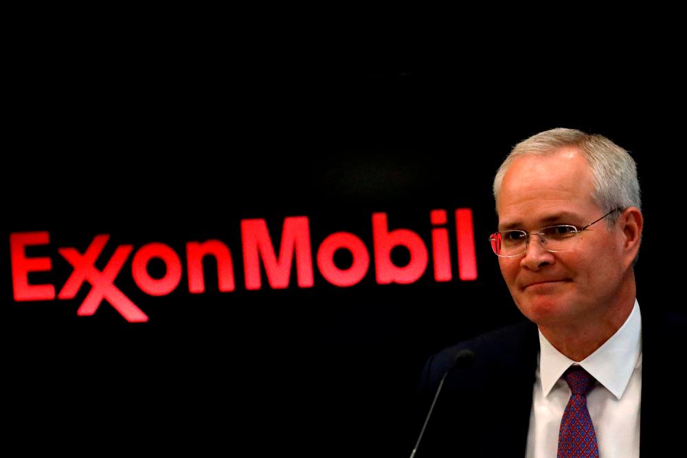 ExxonMobil touts growing dividends, cutting spending as climate challenges loom for Big Oil