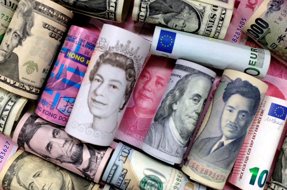 Euro, Hong Kong dollar, US dollar, Japanese yen, pound and Chinese 100 yuan banknotes are seen in this picture illustration. Wealthy countries as a group saw total debt decline roughly US$6 trillion to US$200 trillion. – Reuterspic