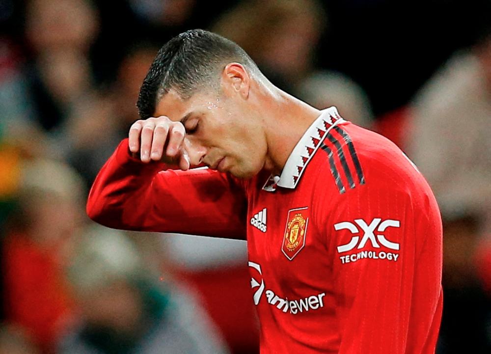 FILE PHOTO: Manchester United's Cristiano Ronaldo reacts/REUTERSPIX