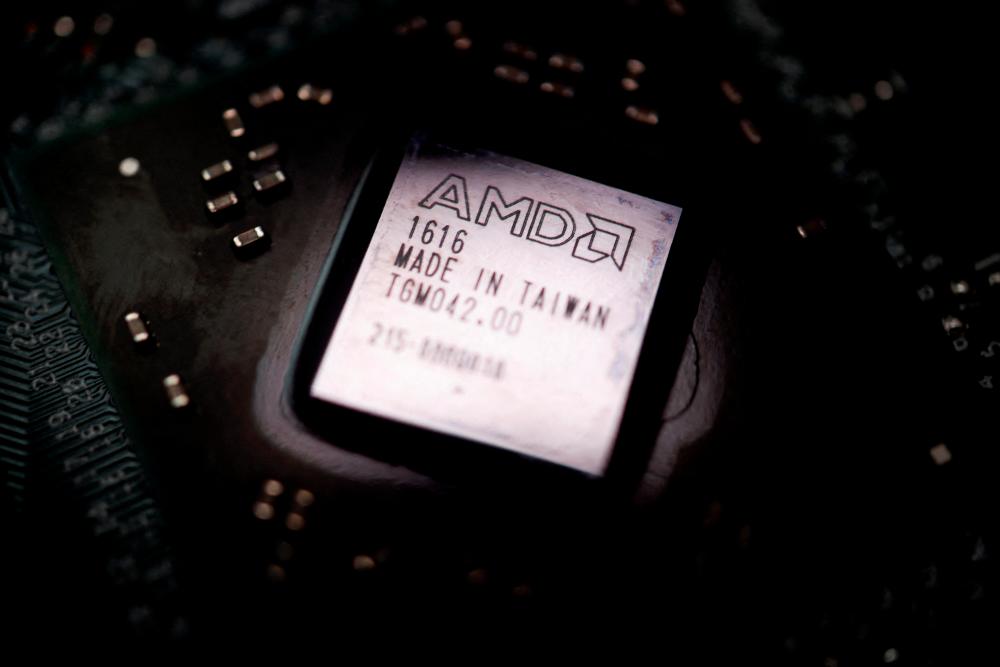 The logo of Advanced Micro Devices Inc is seen on a graphics processing unit chip in this illustration picture. – Reuterspic