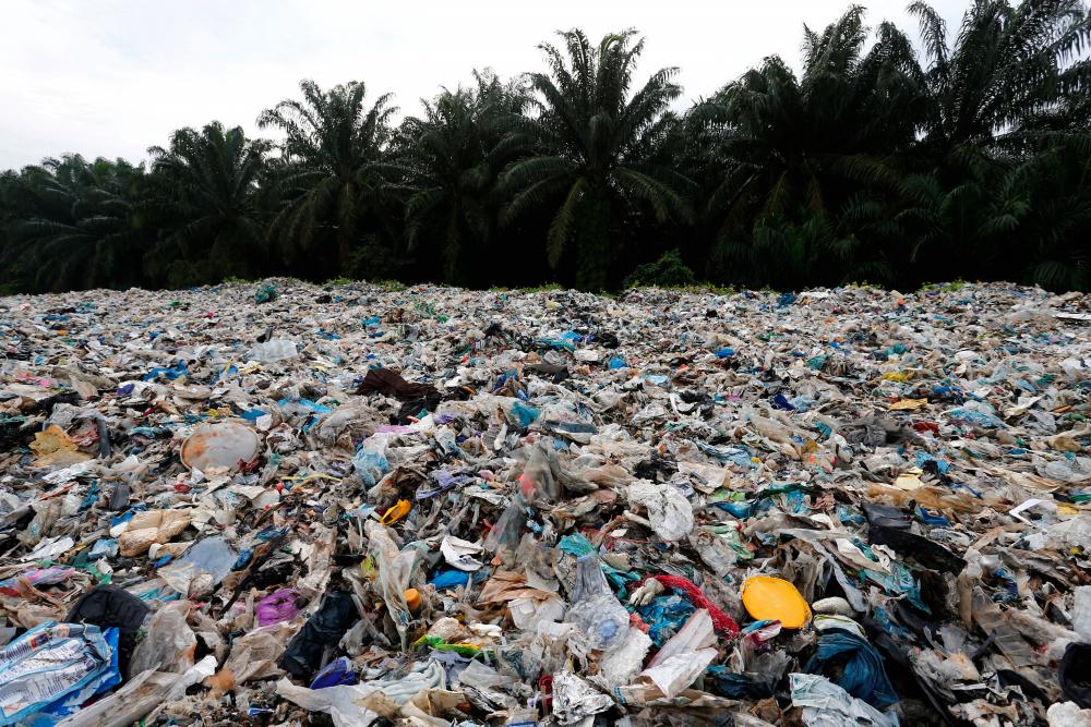 Plastic waste is piled outside an illegal recycling factory in Jenjarom, Kuala Langat, October 14, 2018. - Reuters