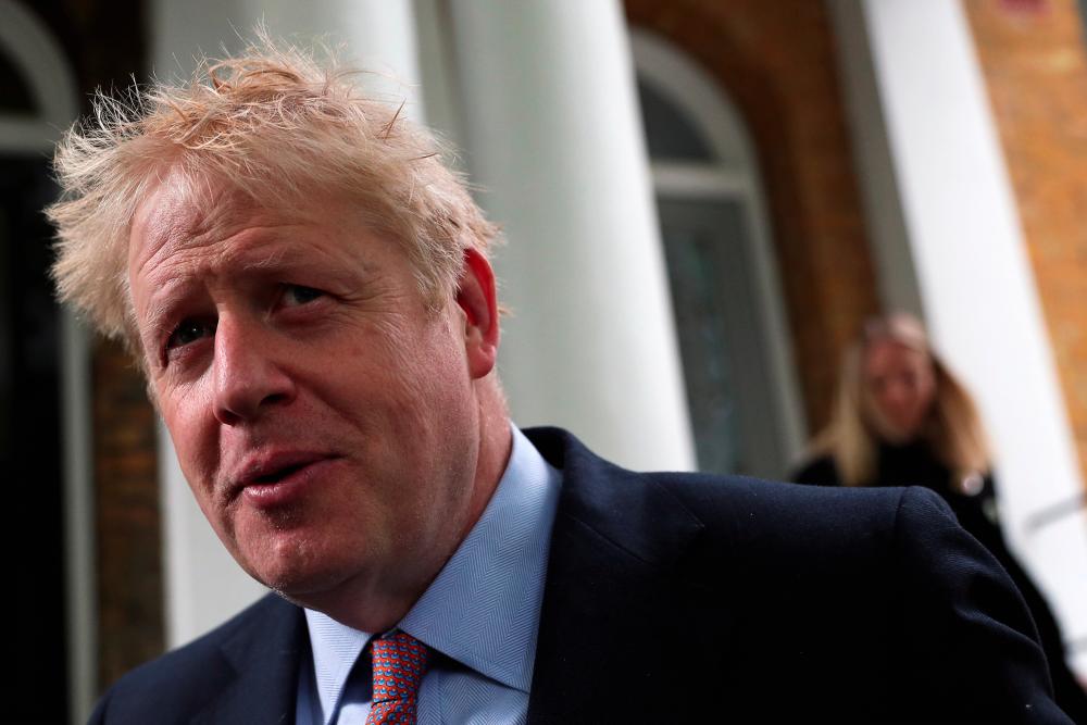 PM hopeful Boris Johnson leaves his home in London, Britain, June 17, 2019. - Reuters