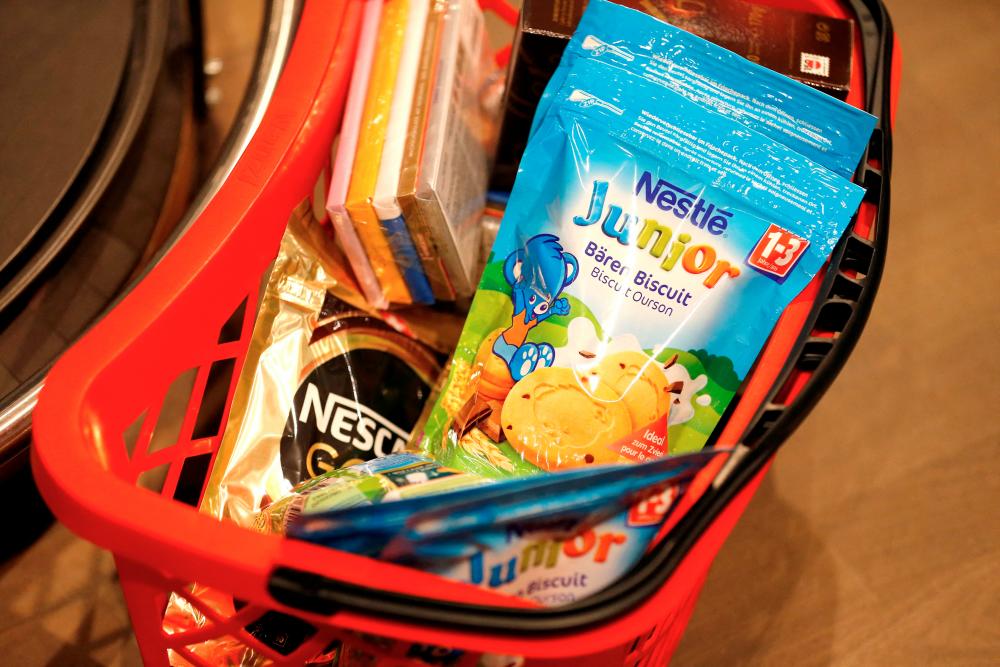 Shopping bag with Nestle products is pictured in the supermarket of Nestle headquarters in Vevey, Switzerland. Switzerland-based Nestle increased prices by nearly 10% during the first quarter even as sales volumes fell 0.5%. – Reuterspic