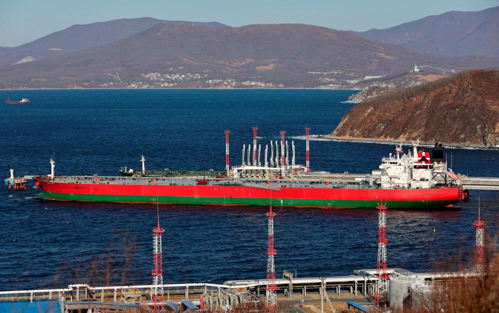 The crude oil tanker Suez Fury is seen anchored at the terminal Kozmino in Nakhodka Bay near the port city of Nakhodka, Russia, on Dec 4, 2022. Russian President Vladimir Putin has signed a decree that bans the supply of oil and oil products to nations participating in the price cap from Feb 1 for five months. – Reuterspic