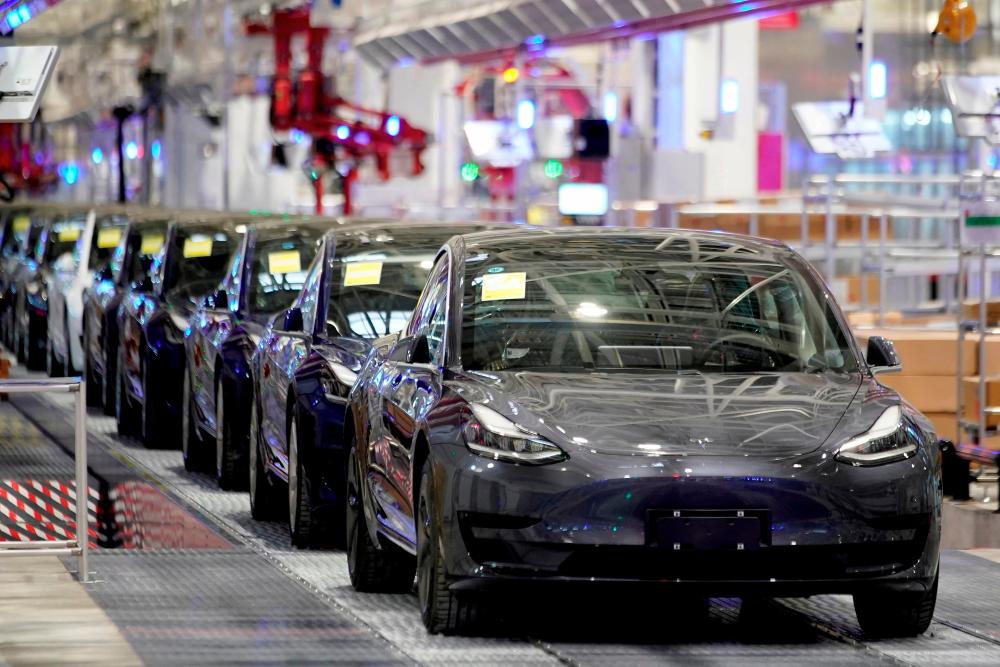 Tesla China-made Model 3 vehicles are seen during a delivery event at its factory in Shanghai, in January 2020. – Reuterspic