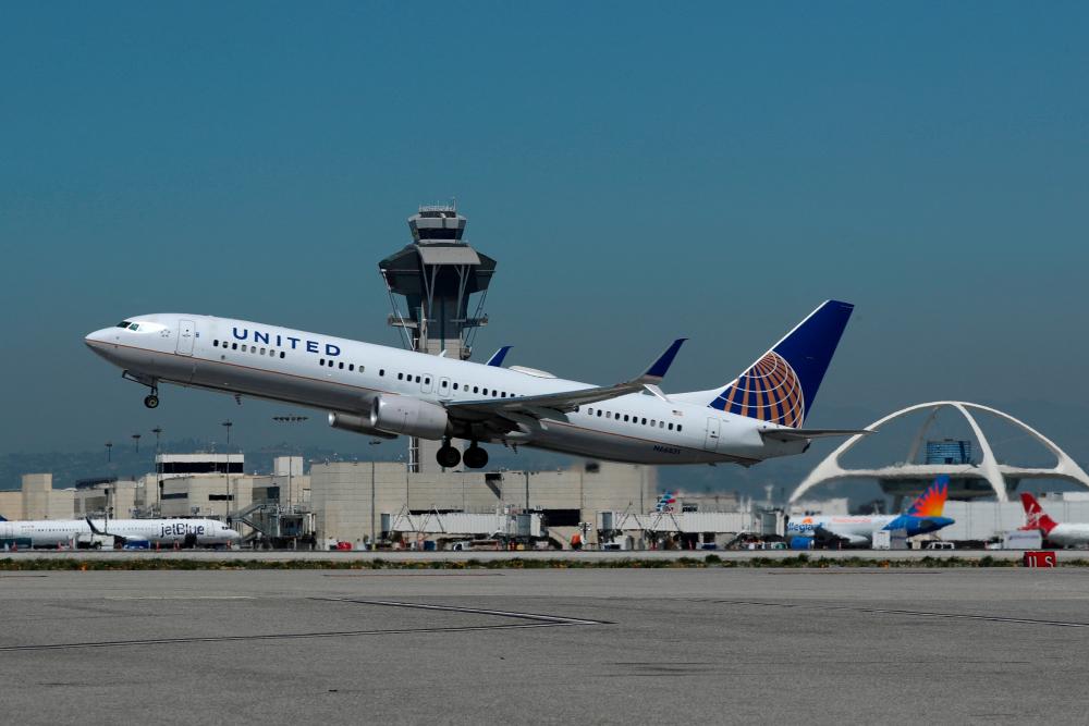 A United Airlines Boeing 737-900ER plane taking off from Los Angeles International Airport. – Reuterspic