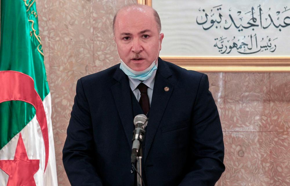 (FILES) In this file photo taken on July 4, 2020 Algerian Minister of Finance Aimene Benabderrahmane speaks during a ceremony in the capital Algiers. Benabderrahmane was named prime minister on June 30, 2021 after legislative elections earlier this month, a presidency statement said. – AFP