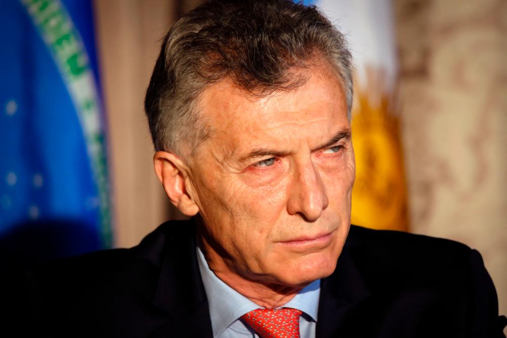 (FILES) In this file photo taken on May 05, 2021 Argentine former President Mauricio Macri attends the InterAmerican Institute for Democracy Forum “Defense of Democracy in the Americas” in Miami, Florida. AFPpix