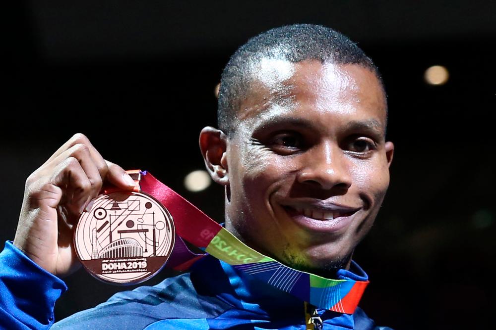 In this file photo taken on October 02, 2019 bronze medallist Ecuador’s Alex Quinonez poses on the podium during the medal ceremony for the Men’s 200m at the 2019 IAAF World Athletics Championships at the Khalifa International stadium in Doha. AFPpix
