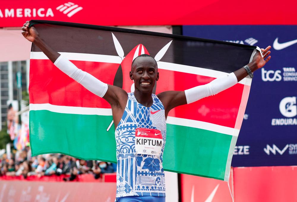 Kenya's Kelvin Kiptum celebrates winning the 2023 Bank of America Chicago Marathon in Chicago, Illinois, in a world record time of two hours and 35 seconds on October 8, 2023. - AFPPIX
