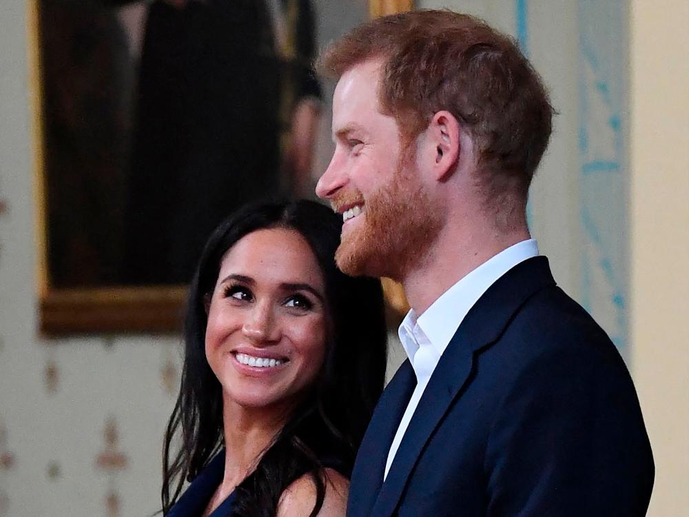 (FILES) In this file photo taken on October 18, 2018 Britain’s Prince Harry and Meghan, Duchess of Sussex attend a reception at Government House in Melbourne. Prince Harry and his wife Meghan announced the birth of their daughter Lilibet Diana US media reported on May 6, 2021.- AFP