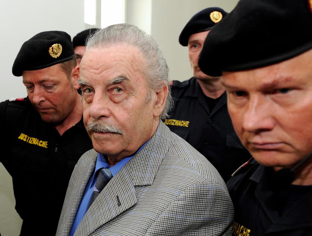 In this file photo taken on Mar 19, 2009, Defendant Josef Fritzl (C) arrives at court on trial for incest and murder on Mar 19, 2009 in the provincial courthouse in Sankt Poelten. — AFP