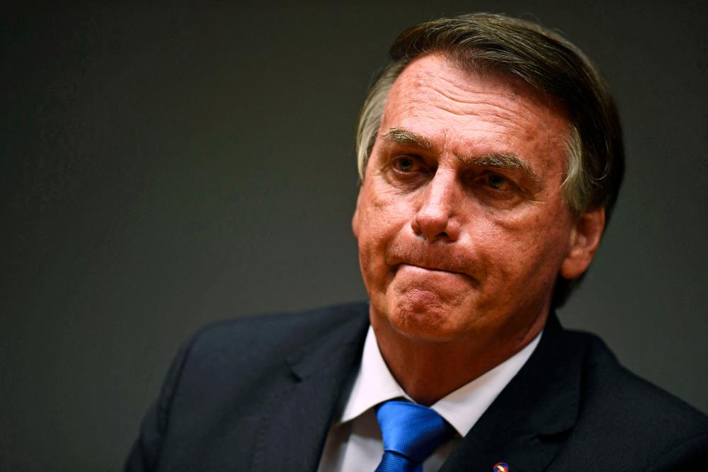 Brazil's Bolsonaro gets in spat with heckler