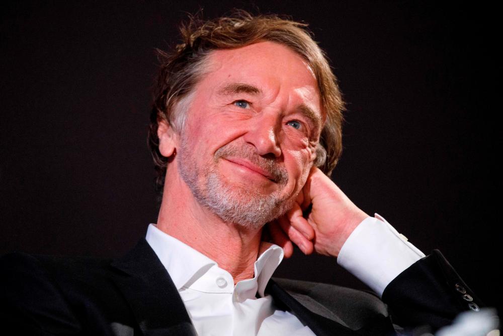 In this file photo taken on Feb 10, 2020 Ineos Chairman Jim Ratcliffe reacts during a media event to reveal the new livery for Mercedes AMG Petronas F1 Team’s race car the for the upcoming 2020 season, at the Royal Automobile Club in London. — AFP