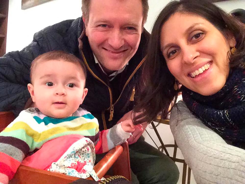In this file photo taken on June 10, 2016 An undated handout image released by the Free Nazanin campaign in London on June 10, 2016 shows Nazanin Zaghari-Ratcliffe (R) posing for a photograph with her husband Richard and daughter Gabriella (L).AFPpix