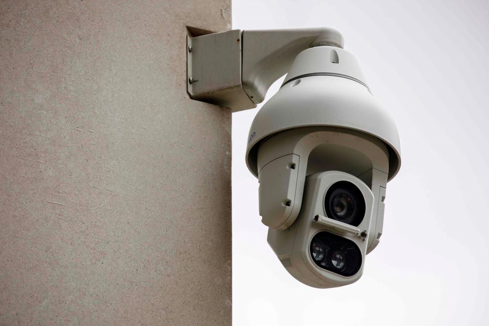 In this file photo taken on Aug 16, 2019 an Avigilon CCTV camera is seen on a wall in King's Cross, London. — AFP