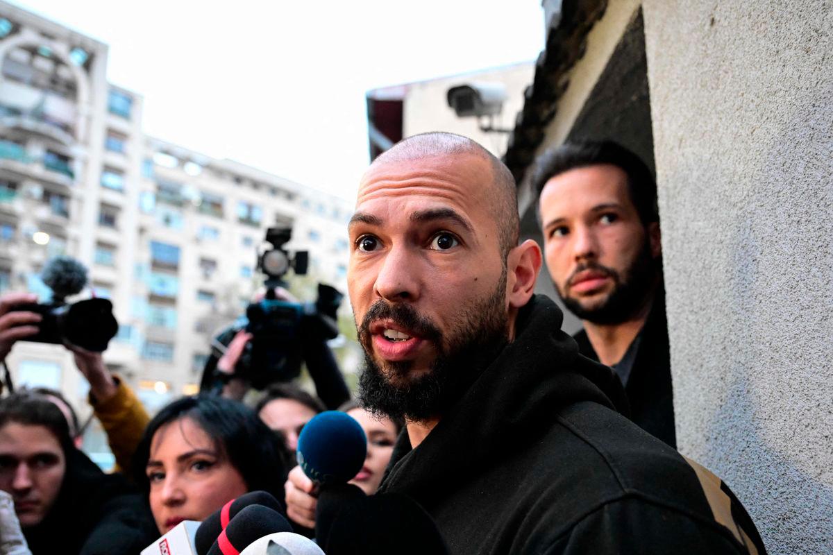 FILEpix: Andrew Tate (C) and his brother Tristan Tate (R) speak to journalists after having been released from detention in Bucharest, Romania on March 12, 2024,. AFPpix