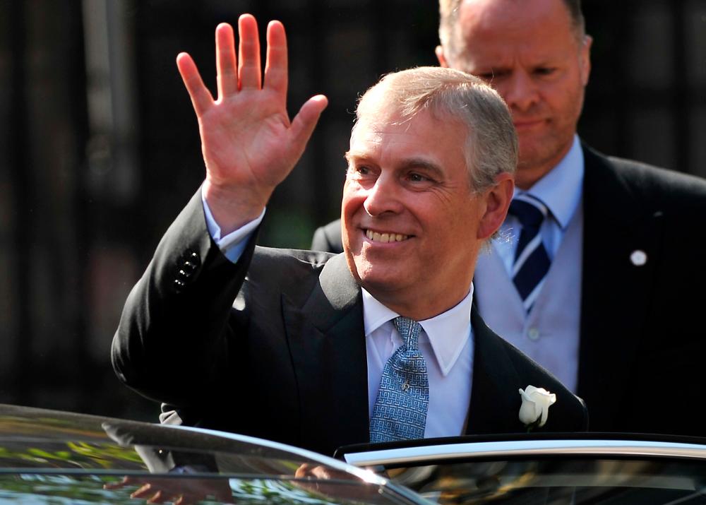 In this file photo taken on July 30, 2011 Britain's Prince Andrew leaves after attending the wedding of Zara Phillips, granddaughter of Britain's Queen Elizabeth II, and England rugby player Mike Tindall at Canongate Kirk in Edinburgh, Scotland. - AFP