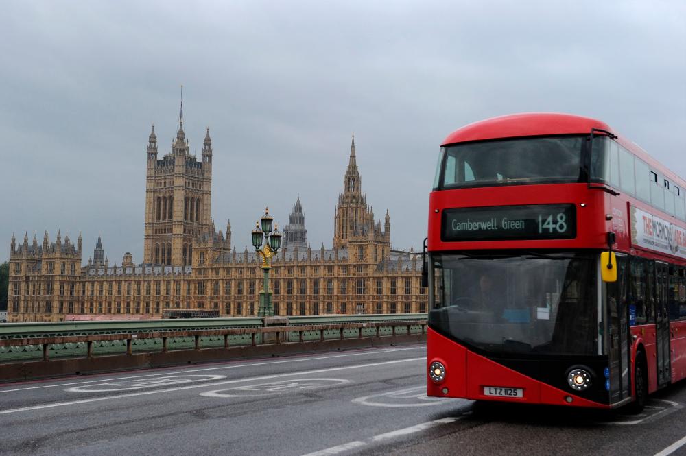 In this file photo taken on October 16, 2021 A bus is driven on Westminster Bridge past the Houses of Parliament in central London on October 16, 2021. AFPpix