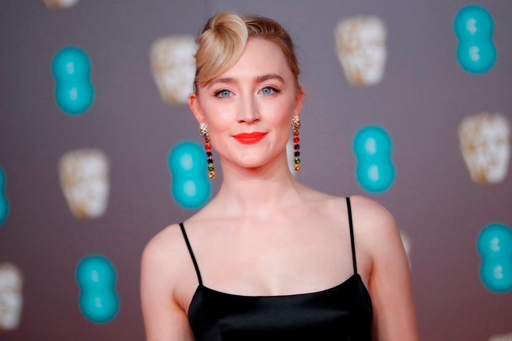$!(FILES) In this file photo taken on February 2, 2020 US-Irish actress Saoirse Ronan poses on the red carpet upon arrival at the BAFTA British Academy Film Awards at the Royal Albert Hall in London. S / AFP / Tolga AKMEN