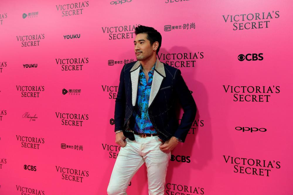 In this file photo taken on November 20, 2017 Canadian actor Godfrey Gao a.k.a. Godfrey Tsao poses on the “Pink Carpet” ahead of the start of the 2017 Victoria’s Secret Fashion Show in Shanghai. - RESTRICTED TO EDITORIAL USE / AFP / Chandan KHANNA / RESTRICTED TO EDITORIAL USE