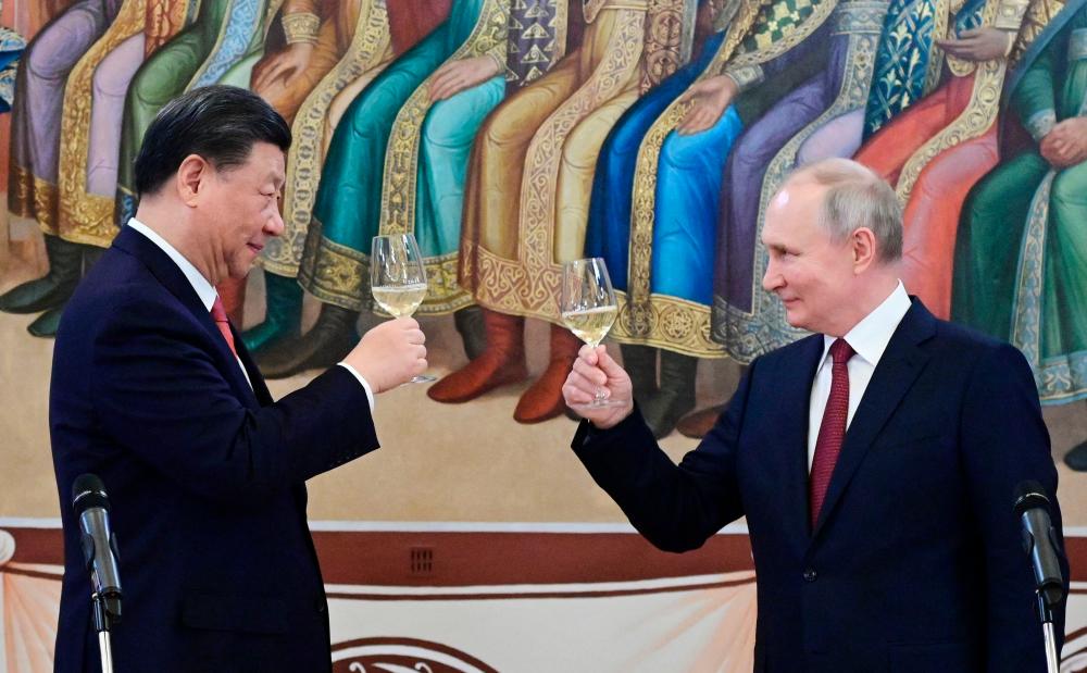 Ten years after toasting a budding friendship with vodka and cake, Xi Jinping and Vladimir Putin will meet again in Beijing this week seeking to further deepen the no-limits partnership between their two countries. AFPPIX