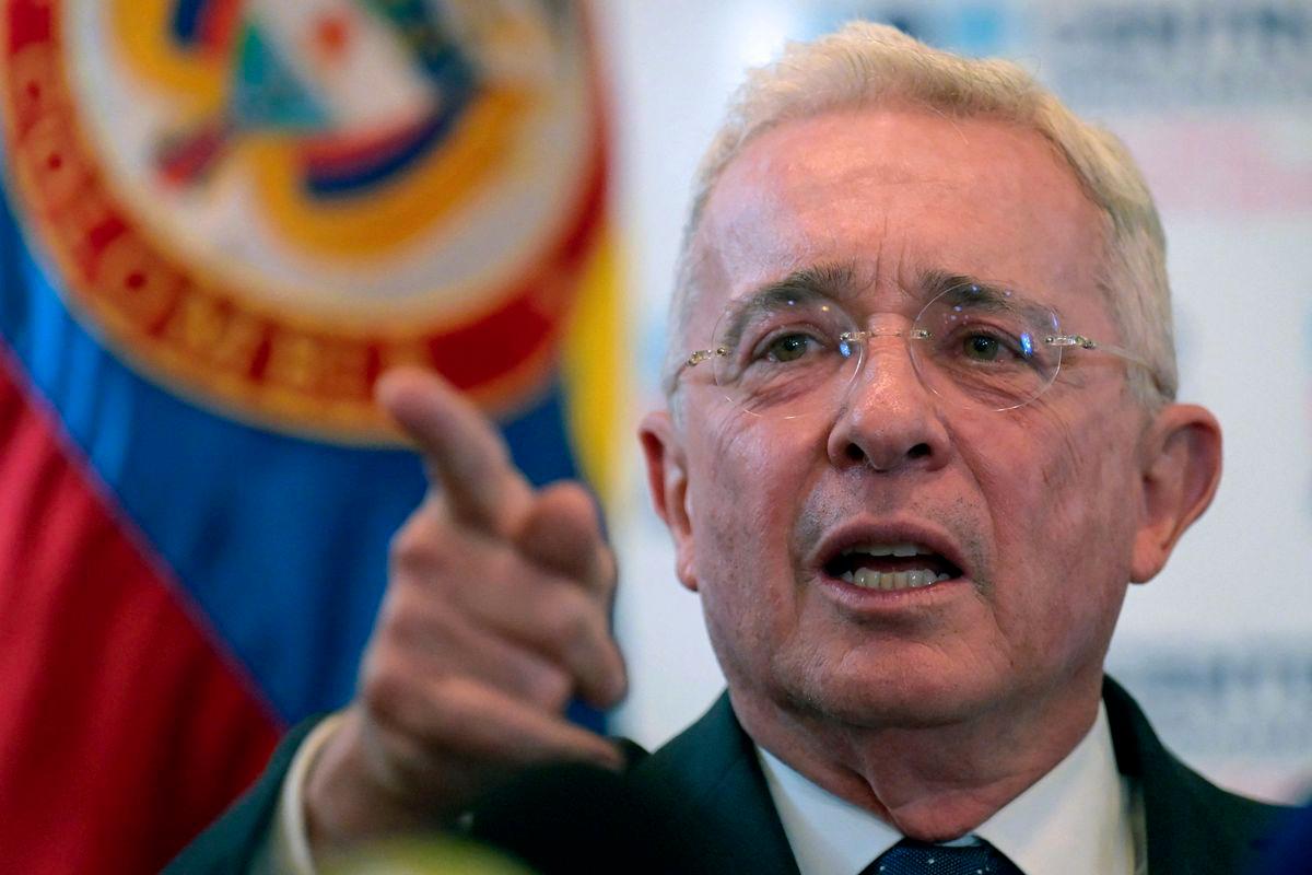Colombian former president (2002–2010) Alvaro Uribe gesturing in a press conference after testifying over a 1997 massacre at the Attorney General's Office in Bogota, on November 27, 2023. - AFPPIX