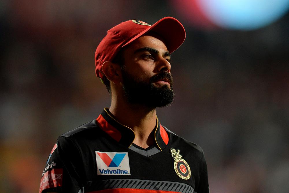 (FILES) In this file photo taken on May 01, 2019 Royal Challengers Bangalore captain Virat Kohli looks on during the 2019 Indian Premier League (IPL) Twenty20 cricket match between Royal Challengers Bangalore and Rajasthan Royals at The M. Chinnaswamy Stadium in Bangalore. AFPPIX