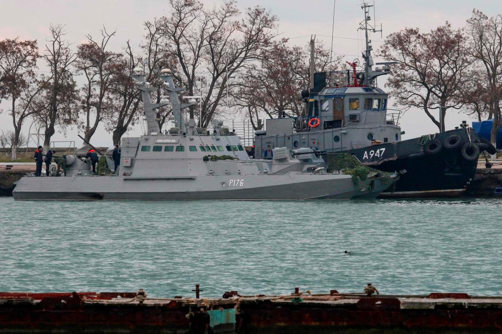 In this file photo taken on Nov 26, 2018, seized Ukrainian military vessels are seen in a port of Kerch, Crimea. — AFP