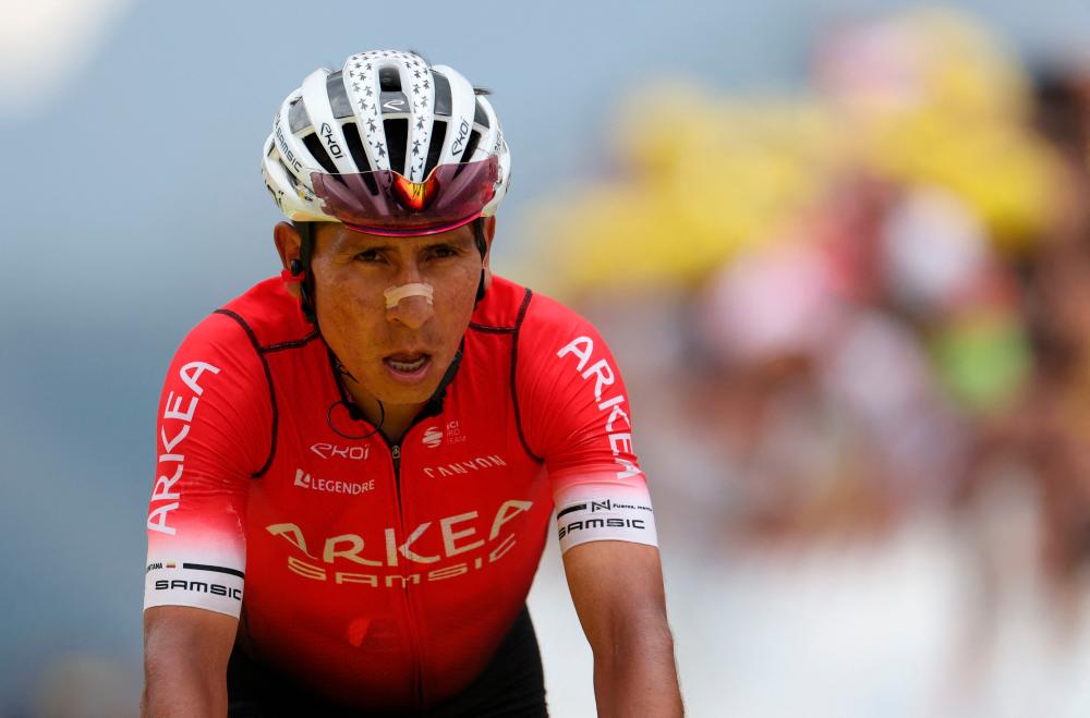 (FILES) In this file photo taken on July 13, 2022 Team Arkea-Samsic team’s Colombian rider Nairo Quintana cycles in the final meters to the finish line of the 11th stage of the 109th edition of the Tour de France cycling race, 151,7 km between Albertville and Col du Granon Serre Chevalier, in the French Alps. AFPPIX