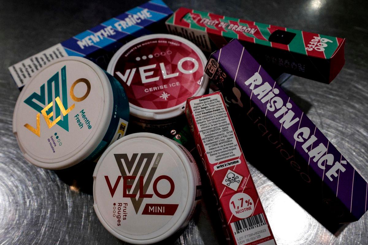 Boxes of “puffs” disposable electronic cigarettes and nicotine pouches displayed in a shop - (Photo by STEPHANE DE SAKUTIN / AFP)