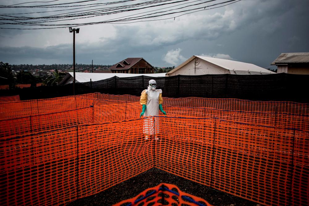 In this file photo taken on Nov 7, 2018 a health worker waits to handle a new unconfirmed Ebola patient at a newly build MSF (Doctors Without Borders) supported Ebola treatment centre (ETC) in Bunia, Democratic Republic of the Congo. — AFP