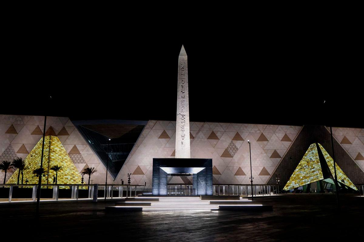 The Obelisk of Ramses II is pictured before the facade and entrance of the new Grand Egyptian Museum in Giza near Cairo - Photo by Ludovic MARIN / POOL / AFP