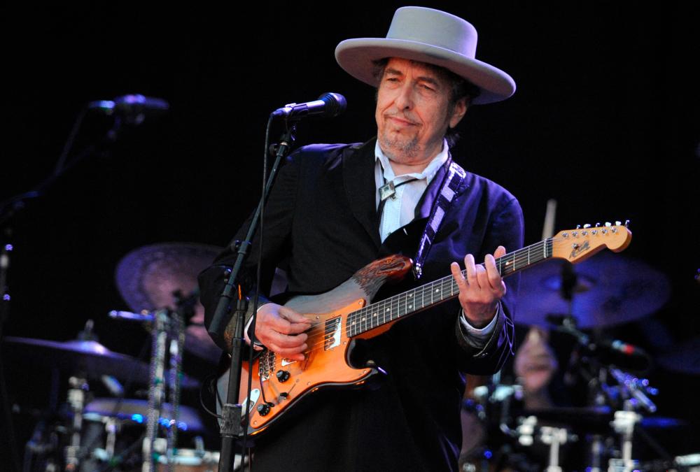 (FILES) In this file photo taken on July 22, 2012 US legend Bob Dylan performs on stage during the 21st edition of the Vieilles Charrues music festival in Carhaix-Plouguer, western France. -AFP