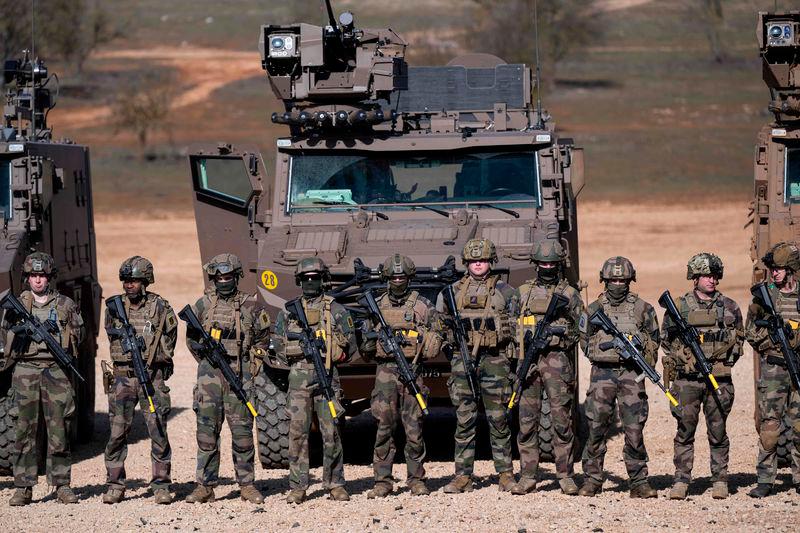 French soldiers stand in line in front of their military vehicles following a combat simulation during the ‘’Scorpion Days’’ manuevers at the French army Canjuers camp - AFPpix