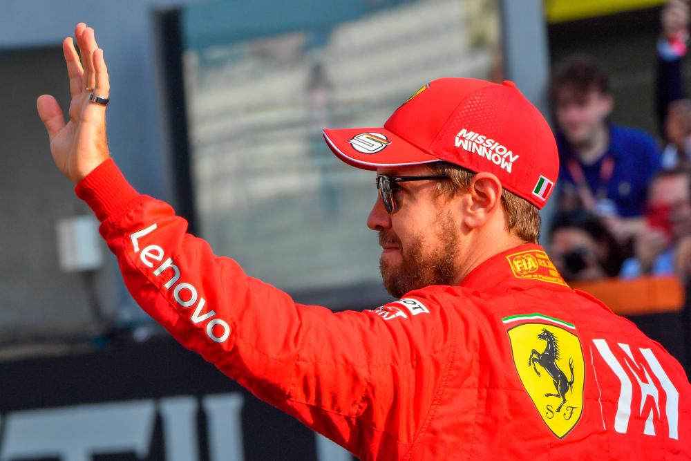 Filepix of Ferrari's German driver Sebastian Vettel waving at the Yas Marina Circuit in Abu Dhabi, ahead of the final race of the 2019 Formula One Grand Prix season. Vettel will leave Ferrari at the end of the 2020 season, AFP reports on May 12, 2020 - AFP