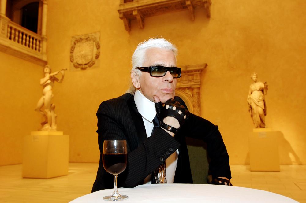 In this file photo taken on May 2, 2005 German fashion designer and creative director of Chanel, Karl Lagerfeld listens to a question during an interview in a room housing the Patio from the Castle of Velez Blanco from Spain at a press preview of Chanel, an exhibition of the history of the fashion House of Chanel at the Metropolitan Museum of Art in New York. — AFP